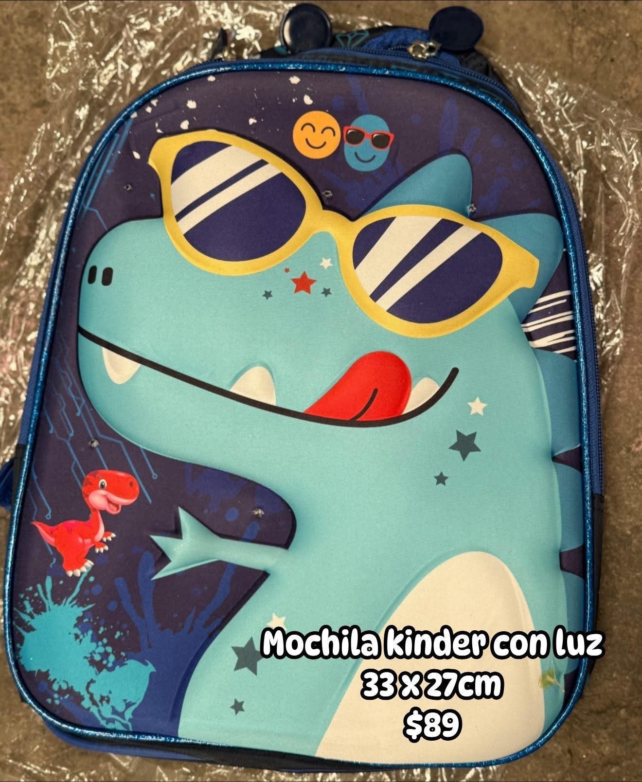 Mochila kinder 33x27cm dinosaurio/lentes